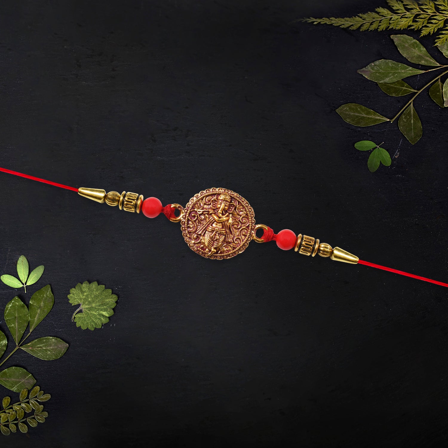 Antique Ganesha Coin Rakhi With Red Beads
