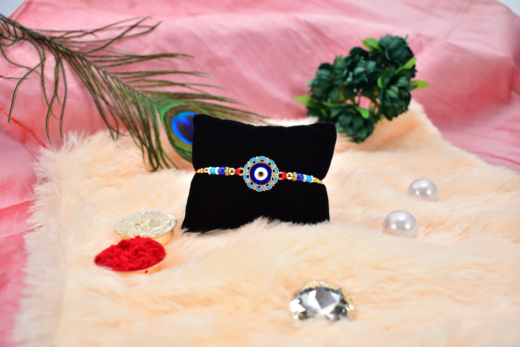 Evil Eye Rakhi With Blue Beads And Golden Accents  Protective Nazar Design